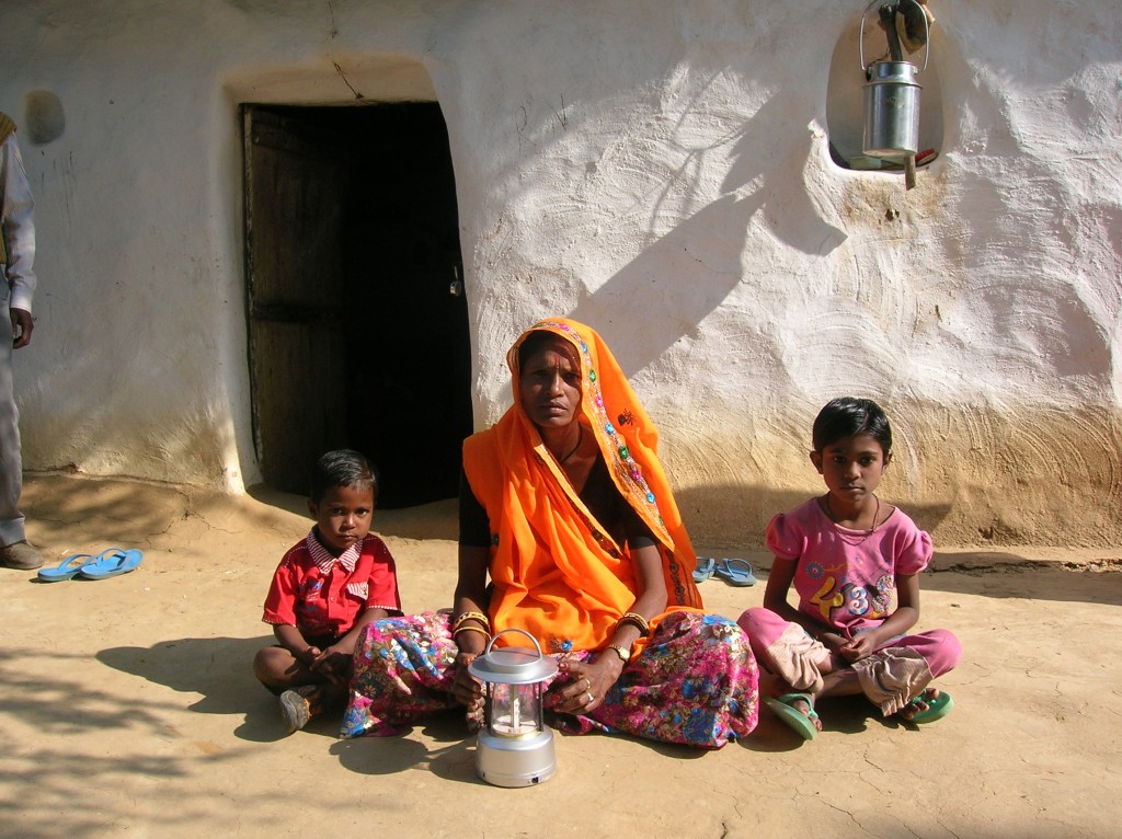 Sanjha Devi and her kids with the new solar lantern!